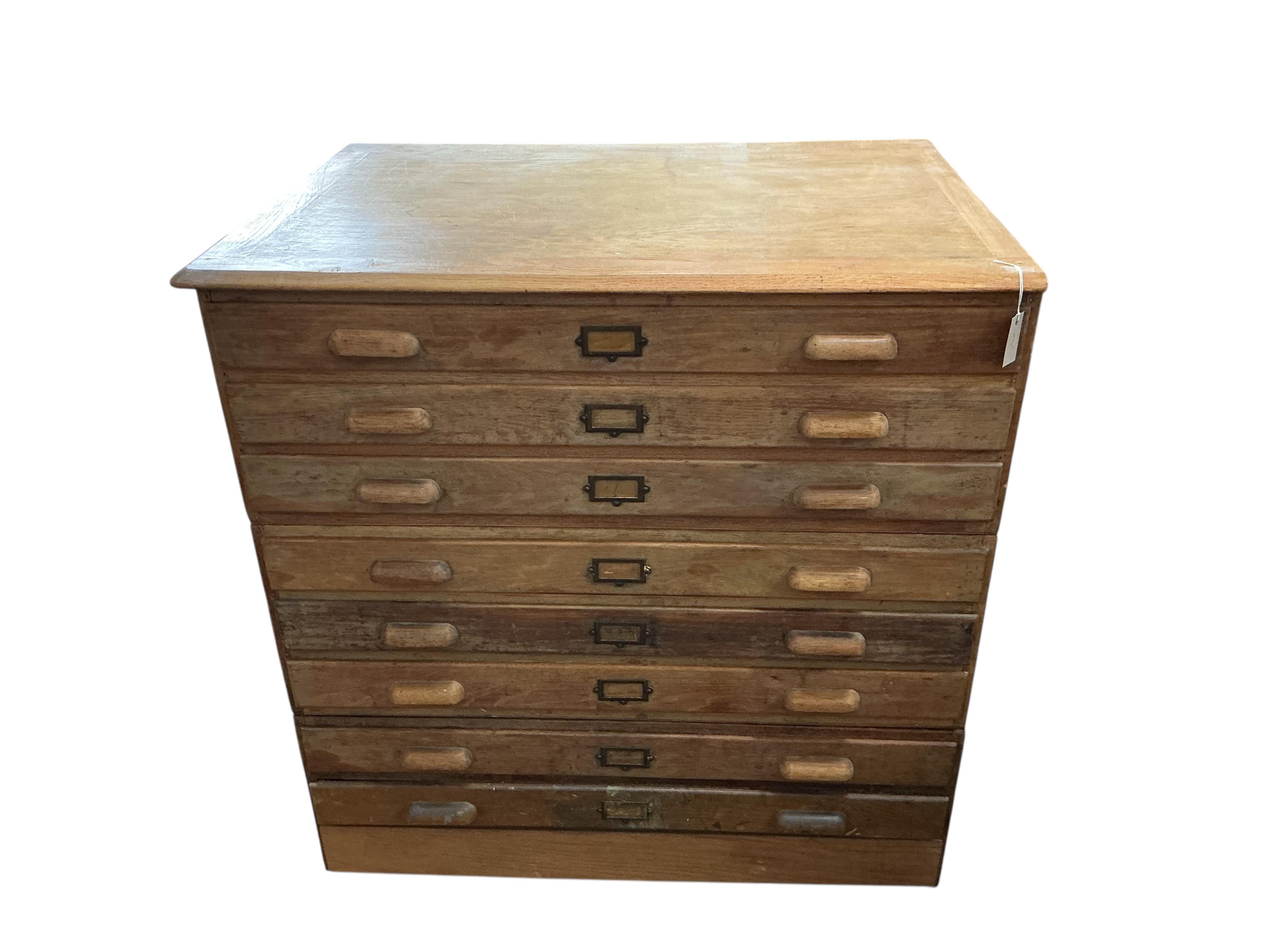 A mid century oak three section plan chest, width 117cm, depth 84cm, height 120cm
